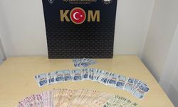 Söke'de sahte parayla alışveriş yaptıkları iddiasıyla gözaltına alınan 2 şüpheliden 1'i tutuklandı